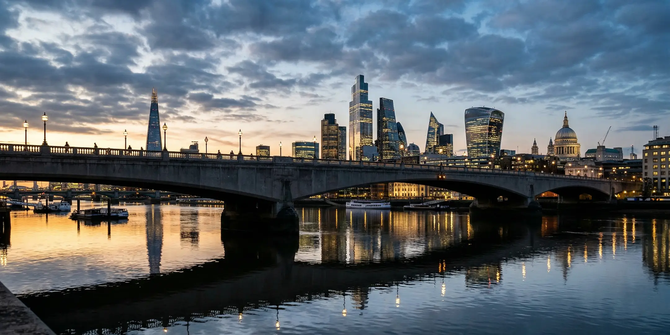 Wide angle shot of a city and a mirroring water image of a bridge