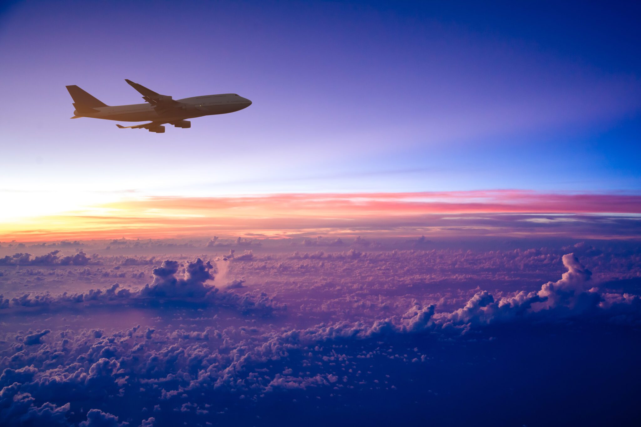 An Airplane on the runway during sunset