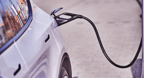 case_study_electricfication A white electronic vehicle charging