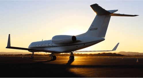 An Airplane on the runway during sunset