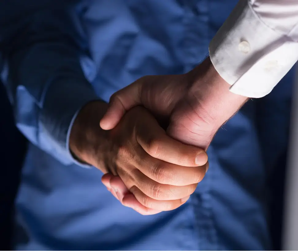Close up of two people handshaking